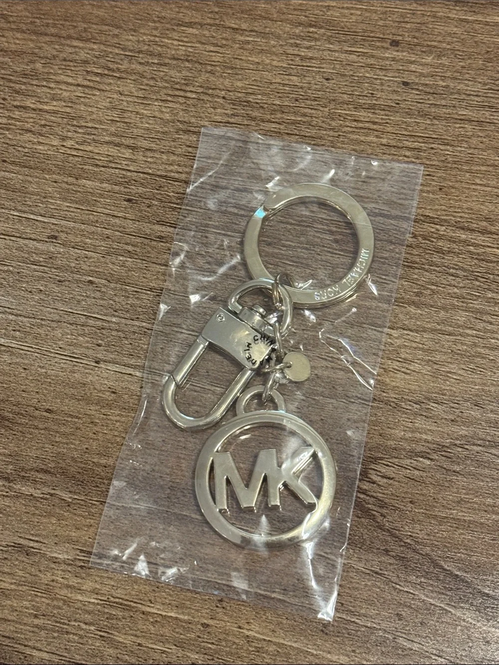 Michael Kors light gold MK Circle Logo bag charm